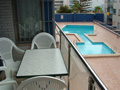 balcony overlooks the communal swimming pool